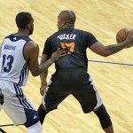Suns forward P.J. Tucker backs in on Memphis' Donte Green. (Photo: Craig Grialou/Arizona Sports)