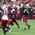 Cardinals QB Carson Palmer lets a pass go during training camp on Friday, July 26 at University of Phoenix Stadium in Glendale. (Adam Green/Arizona Sports)