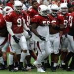 The defense breaks its huddle during the Cardinals' Red & White Practice Saturday, August 3 at University of Phoenix Stadium in Glendale. (Adam Green/Arizona Sports)