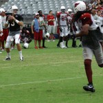 QB Carson Palmer looks to pass while WR Larry Fitzgerald runs his route during the Cardinals' Red & White Practice Saturday, August 3 at University of Phoenix Stadium in Glendale. (Adam Green/Arizona Sports)