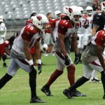 Receivers Michael Floyd, Larry Fitzgerald and Andre Roberts line up during the Cardinals' Red & White Practice Saturday, August 3 at University of Phoenix Stadium in Glendale. (Adam Green/Arizona Sports)