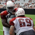 Linemen Jonathan Cooper and Mike Gibson run through a drill during the Cardinals' Red & White Practice Saturday, August 3 at University of Phoenix Stadium in Glendale. (Adam Green/Arizona Sports)