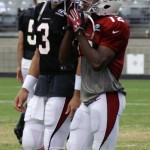 Receiver Andre Roberts and quarterback Carson Palmer chat during Arizona Cardinals training camp Monday, Aug. 12, at University of Phoenix Stadium in Glendale. (Adam Green/Arizona Sports)