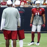 Receiver Larry Fitzgerald receives instruction from head coach Bruce Arians during Arizona Cardinals training camp Tuesday, Aug. 13 at University of Phoenix Stadium in Glendale. (Adam Green/Arizona Sports)