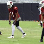 Front to back: Receivers Michael Floyd (15), Larry Fitzgerald (11) and Patrick Peterson during Arizona Cardinals training camp at University of Phoenix Stadium on Aug. 22, 2013. (Adam Green/Arizona Sports)