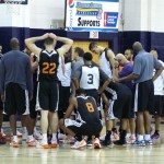 Team huddled up after practice. Channing Frye shown crouching. (Photo: Craig Grialou/Arizona Sports)