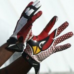 Karlos Dansby's Cardinals-themed gloves during practice at the team's Tempe training facility Nov. 27, 2013. (Adam Green/Arizona Sports)