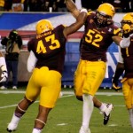 Arizona State's Carl Bradford (right) and Davon Coleman (left) celebrate after a sack against Stanford during the NCAA Pac-12 Championship football game on Saturday, Dec. 7, 2013 in Tempe, Ariz. (Photo by Clayton Klapper/KTAR)