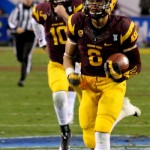 Arizona State's D.J. Foster (center) runs for a touchdown against Stanford during the NCAA Pac-12 Championship football game on Saturday, Dec. 7, 2013 in Tempe, Ariz. (Photo by Clayton Klapper/KTAR)