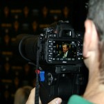 ASU President Michael Crow threw can be seen in a photographer's viewfinder during the introductory press conference for new Vice President for Athletics Ray Anderson at the Hyatt Regency Resort in Scottsdale, Jan. 9, 2014. (Adam Green/Arizona Sports)