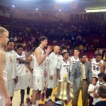 Former Arizona State star Eddie House (center, in suit) rings the victory bell with current Sun Devils players after Saturday's 72-51 defeat of Colorado at Wells Fargo Arena. (Twitter photo/@TheSunDevils)