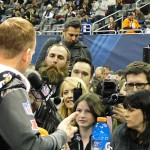 Denver quarterback Peyton Manning answers questions from the media, including Pittsburgh linebacker Brett Keisel (and his magical beard) at Super Bowl XLVIII Media Day Tuesday, Jan. 28, 2014 at the Prudential Center in Newark, New Jersey. (Photo: Vince Marotta/Arizona Sports)