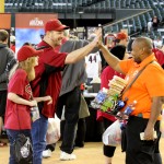 Fans interact with a vendor at the Arizona Diamondbacks' 2014 Fan Fest Saturday, February 8 at Chase Field (Clayton Klapper/Arizona Sports).