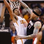 Miami Heat's Chris Andersen (11) gets his shot blocked by Phoenix Suns' Gerald Green during the second half of an NBA basketball game Tuesday, Feb. 11, 2014, in Phoenix. (AP Photo/Ross D. Franklin)