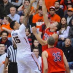 Arizona's Nick Johnson (13) defends a shot against Oregon State's Eric Moreland (15) during the first half of an NCAA college basketball game in Corvallis, Ore., Wednesday March 5, 2014. (AP Photo/Greg Wahl-Stephens)
