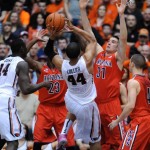 Arizona's Matt Korcheck (31) fouls against Oregon State's Devon Collier (44) during the first half of an NCAA college basketball game in Corvallis, Ore., Wednesday March 5, 2014. (AP Photo/Greg Wahl-Stephens)