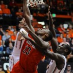 Arizona's Rondae Hollis-Jefferson (23) shoots against Oregon State's Daniel Gomis (14) during the first half of an NCAA college basketball game in Corvallis, Ore., Wednesday March 5, 2014. (AP Photo/Greg Wahl-Stephens)