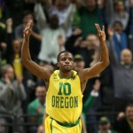 Oregon's Johnathan Loyd signals to the crowd after hitting a 3-point shot late in the second half against Arizona in an NCAA college basketball game in Eugene, Ore. on Saturday, March 8, 2014. (AP Photo/Chris Pietsch)