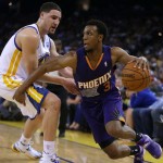 Phoenix Suns' Ish Smith, right, drives the ball against Golden State Warriors' Klay Thompson during the second half of an NBA basketball game Sunday, March 9, 2014, in Oakland, Calif. (AP Photo/Ben Margot)