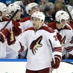 Phoenix Coyotes left wing Brandon McMillan (38) celebrates with teammates after his goal against the Tampa Bay Lightning during the second period of an NHL hockey game, Monday, March 10, 2014, in Tampa, Fla. (AP Photo/Chris O'Meara)