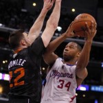 Los Angeles Clippers guard Willie Green (34) shoots over Phoenix Suns center Miles Plumlee (22) during the first half of an NBA basketball game Monday, March 10, 2014, in Los Angeles. (AP Photo/Alex Gallardo)