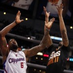 Los Angeles Clippers center DeAndre Jordan (6) battles for a rebound against Phoenix Suns forward Markieff Morris (11) during the first half of an NBA basketball game Monday, March 10, 2014, in Los Angeles. (AP Photo/Alex Gallardo)