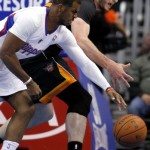 Los Angeles Clippers guard Chris Paul, left, steals the ball away from Phoenix Suns center Miles Plumlee, right, during the first half of an NBA basketball game Monday, March 10, 2014, in Los Angeles. (AP Photo/Alex Gallardo)