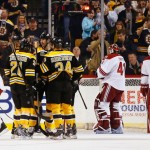 Boston Bruins defenseman Zdeno Chara, center, of Slovakia is congratulated by teammates Loui Eriksson (21) of Sweden and Carl Soderberg (34) of Sweden after scoring as Phoenix Coyotes' Derek Morris (53), Keith Yandle (3) and goalie Mike Smith skate away during the first period of an NHL hockey game in Boston Thursday, March 13, 2014. (AP Photo/Winslow Townson)