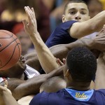 Arizona and UCLA players vie for a rebound in the first half during the championship game of the NCAA Pac-12 conference college basketball tournament, Saturday, March 15, 2014, in Las Vegas. (AP Photo/Julie Jacobson)