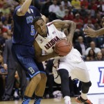 Arizona's Rondae Hollis-Jefferson, right, drives against UCLA's Kyle Anderson in the first half during the championship game of the NCAA Pac-12 conference college basketball tournament, Saturday, March 15, 2014, in Las Vegas. (AP Photo/Julie Jacobson)
