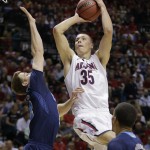 Arizona's Kaleb Tarczewski shoots against UCLA's David Wear in the first half during the championship game of the NCAA Pac-12 conference college basketball tournament, Saturday, March 15, 2014, in Las Vegas. (AP Photo/Julie Jacobson)