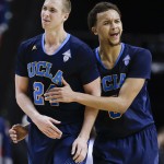 UCLA's Travis Wear (24) walks to the bench with Kyle Anderson after fouling out in the second half during the championship game of the NCAA Pac-12 conference college basketball tournament, Saturday, March 15, 2014, in Las Vegas. UCLA won 75-71. (AP Photo/Julie Jacobson)