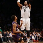 Brooklyn Nets's Paul Pierce shoots over Phoenix Suns' Ish Smith during the first half of the NBA basketball game at the Barclays Center Monday, March 17, 2014 in New York. (AP Photo/Seth Wenig)