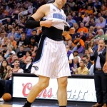 Orlando Magic forward Nikola Vucevic leaves the NBA basketball game against the Phoenix Suns after getting his second technical foul, during the first half Wednesday, March 19, 2014, in Phoenix. (AP Photo/Matt York)