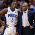 Orlando Magic guard Victor Oladipo (5) talks with coach Jacque Vaughn during the first half of an NBA basketball game against the Phoenix Suns, Wednesday, March 19, 2014, in Phoenix. (AP Photo/Matt York)