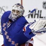 New York Rangers goalie Henrik Lundqvist makes a save during the first period of the NHL hockey game against the Phoenix Coyotes, Monday, March 24, 2014, in New York. (AP Photo/Seth Wenig)