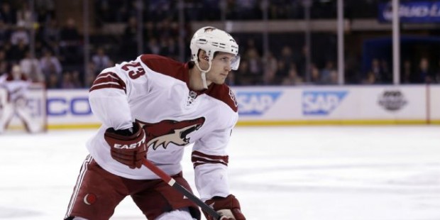Phoenix Coyotes’ Oliver Ekman-Larsson moves the puck up the ice before scoring during the fir...