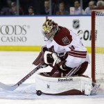 Phoenix Coyotes goalie Mike Smith makes a save during the second period of the NHL hockey game against the New York Rangers, Monday, March 24, 2014, in New York. (AP Photo/Seth Wenig)