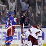 New York Rangers' Ryan McDonagh, left, and Phoenix Coyotes goalie Thomas Greiss react after McDonagh scored the winning goal in overtime at the NHL hockey game, Monday, March 24, 2014, in New York. The Rangers defeated the Coyotes in overtime 4-3. (AP Photo/Seth Wenig)