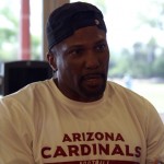 Speed coach Roger Kingdom talks with the media after voluntary workouts at the team's Tempe training facility on April 24, 2014. (Adam Green/Arizona Sports)