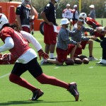 Receiver Larry Fitzgerald starts his route while Carson Palmer drops back to pass during Arizona Cardinals OTAs at the team's Tempe training facility May 27, 2014. (Adam Green/Arizona Sports)