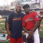Arizona Cardinals wide receiver Larry Fitzgerald poses with Minnesota Vikings running back Adrian Peterson at the Legends and Celebrity Softball Game on Sunday. (Twitter photo/@LarryFitzgerald)