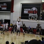 Phoenix Suns forward Elias Harris attempts a 3-point field goal over the Minnesota Timberwolves' Gorgui Dieng in the first half of an NBA Summer League game on Wednesday, July 16, 2014. (Arizona Sports photo/Andrew Gilstrap)