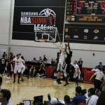 Minnesota Timberwolves center Gorgui Dieng shoots over the Phoenix Suns' Alec Brown in the second half of an NBA Summer League game on Wednesday, July 16, 2014. (Arizona Sports photo/Andrew Gilstrap)