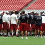 The Cardinals gather as a team following the conditioning test at University of Phoenix Stadium in Glendale, Ariz, on July 25. (Adam Green/Arizona Sports)