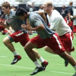 Rob Housler (front) is one of the players running during the Cardinals conditioning test at University of Phoenix Stadium in Glendale, Ariz, on July 25. (Adam Green/Arizona Sports)