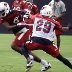 Dan Buckner tries to get by Teddy Williams during Arizona Cardinals training camp July 26, 2014. (Adam Green/Arizona Sports)