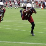Larry Fitzgerald can't come up with the pass during Arizona Cardinals training camp July 26, 2014. (Adam Green/Arizona Sports)