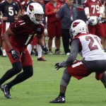 Larry Fitzgerald and Patrick Peterson are matched up during Arizona Cardinals training camp July 26, 2014. (Adam Green/Arizona Sports)