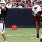 Carson Palmer directs the offense as Larry Fitzgerald waits for the snap during Arizona Cardinals training camp July 28, 2014. (Adam Green/Arizona Sports)